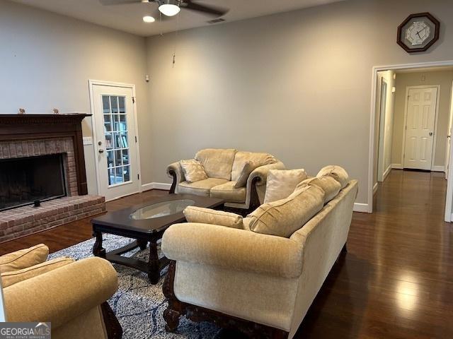 1009 Hunters Pointe Dr, Statesboro, GA 30461 - living room featuring ceiling fan, baseboards, dark wood-style floors, a brick fireplace, and recessed lighting