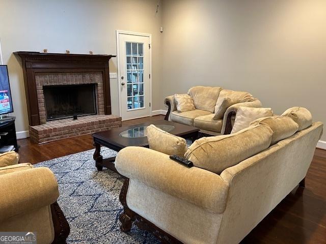1009 Hunters Pointe Dr, Statesboro, GA 30461 - living area with a fireplace, baseboards, and wood finished floors
