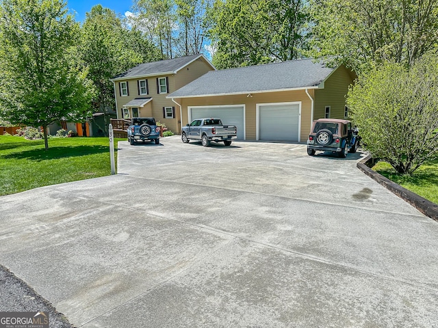 30 Putter Ln, Dillard, GA 30537 - view of front facade with driveway, an attached garage, and a front yard