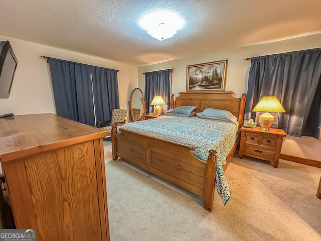30 Putter Ln, Dillard, GA 30537 - bedroom with light carpet, a textured ceiling, and baseboards