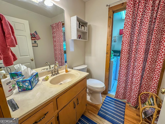 30 Putter Ln, Dillard, GA 30537 - full bath with independent washer and dryer, toilet, wood finished floors, vanity, and a shower with shower curtain