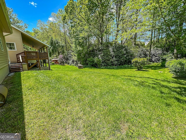 30 Putter Ln, Dillard, GA 30537 - view of grassy yard featuring stairs and a wooden deck