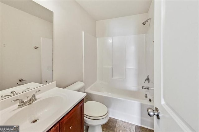 bathroom featuring toilet, tub / shower combination, and vanity