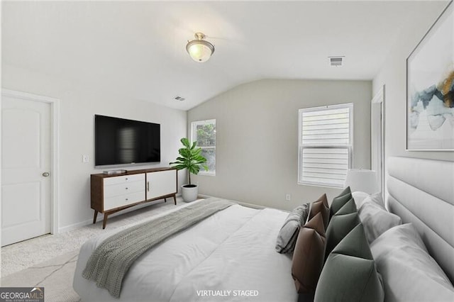 bedroom featuring lofted ceiling, carpet floors, and baseboards