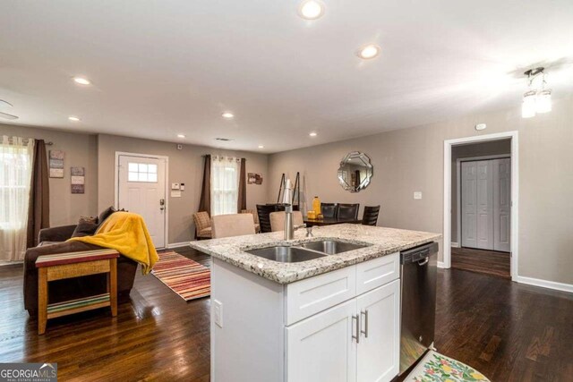 3224 Canary Ct, Decatur, GA 30032 - kitchen with stainless steel dishwasher, open floor plan, dark wood-style floors, light stone counters, and recessed lighting
