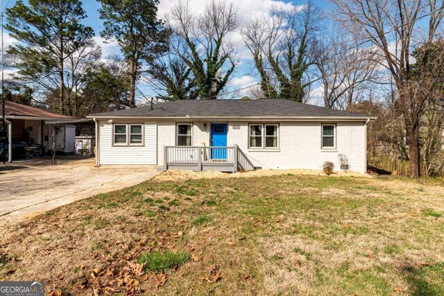 3224 Canary Ct, Decatur, GA 30032 - ranch-style house with a front lawn, driveway, and brick siding