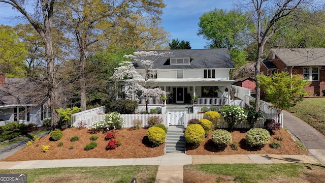 211 E 11th St SE, Rome, GA 30161 - traditional style home featuring covered porch, a fenced front yard, a gate, and stairs
