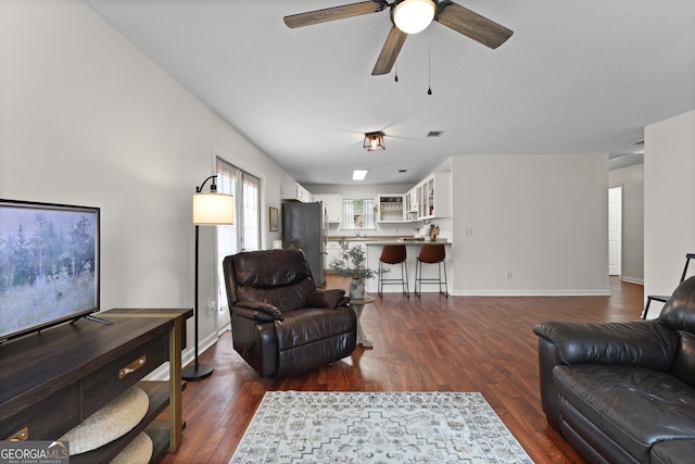 142 Dawn Cir, Brunswick, GA 31523 - living area featuring dark wood finished floors and ceiling fan
