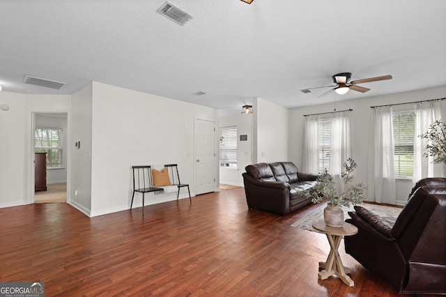 142 Dawn Cir, Brunswick, GA 31523 - living room with plenty of natural light, a ceiling fan, wood finished floors, and baseboards