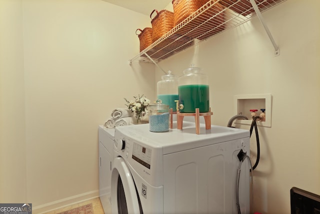142 Dawn Cir, Brunswick, GA 31523 - washroom featuring washing machine and clothes dryer and baseboards