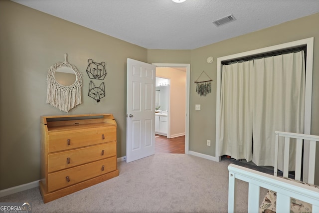 142 Dawn Cir, Brunswick, GA 31523 - carpeted bedroom featuring baseboards and a textured ceiling