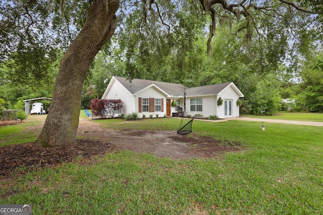 142 Dawn Cir, Brunswick, GA 31523 - ranch-style home featuring driveway and a front yard