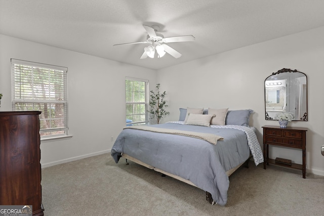 142 Dawn Cir, Brunswick, GA 31523 - carpeted bedroom featuring baseboards and a ceiling fan