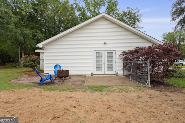 142 Dawn Cir, Brunswick, GA 31523 - rear view of property with french doors, a patio area, and a gate