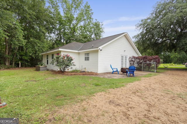 142 Dawn Cir, Brunswick, GA 31523 - view of home's exterior featuring a patio and a yard