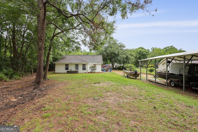 142 Dawn Cir, Brunswick, GA 31523 - view of green lawn with a detached carport