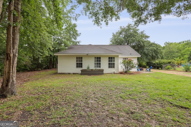 142 Dawn Cir, Brunswick, GA 31523 - back of house featuring a patio