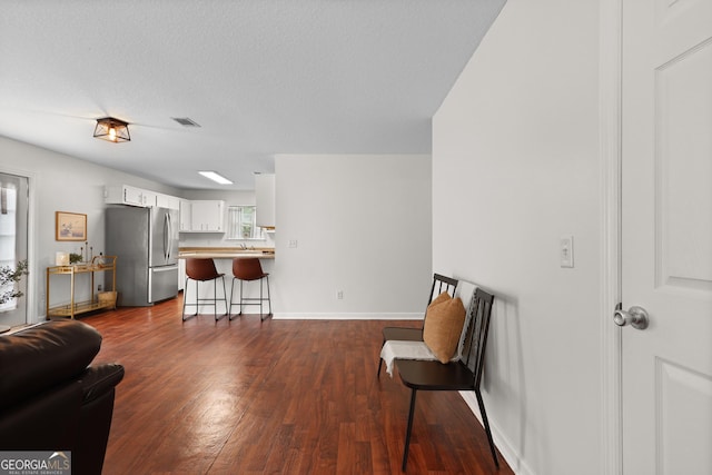142 Dawn Cir, Brunswick, GA 31523 - sitting room featuring dark wood finished floors and baseboards