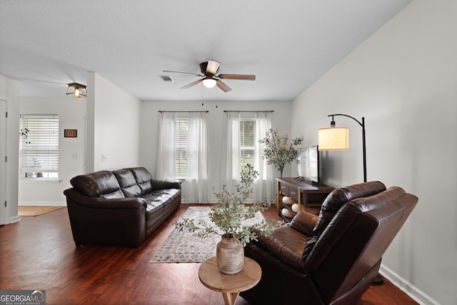 142 Dawn Cir, Brunswick, GA 31523 - living room featuring dark wood finished floors, a ceiling fan, and baseboards