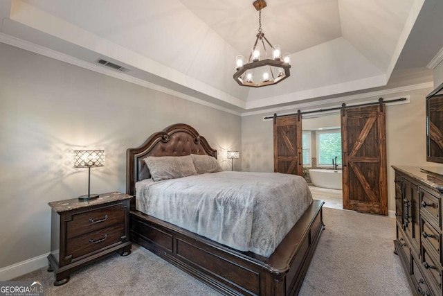 bedroom featuring light carpet, a raised ceiling, a barn door, a chandelier, and crown molding