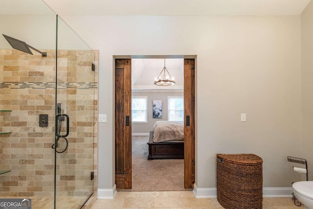 full bathroom with a stall shower, a chandelier, and baseboards