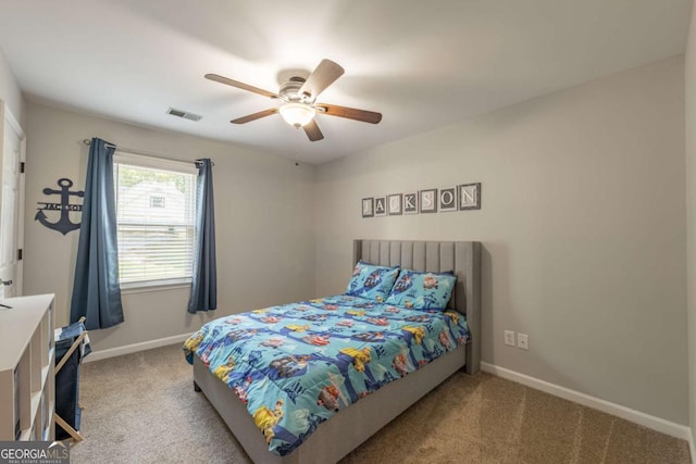 bedroom featuring carpet, baseboards, and a ceiling fan