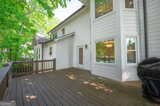 wooden deck with grilling area