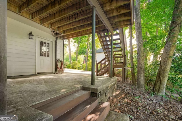 wooden deck featuring stairs