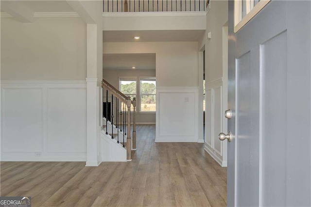 612 Sidney Ct, Stockbridge, GA 30281 - foyer with a decorative wall, wood finished floors, stairway, and a wainscoted wall