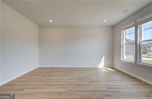 612 Sidney Ct, Stockbridge, GA 30281 - spare room featuring healthy amount of natural light, light wood-style floors, recessed lighting, and baseboards