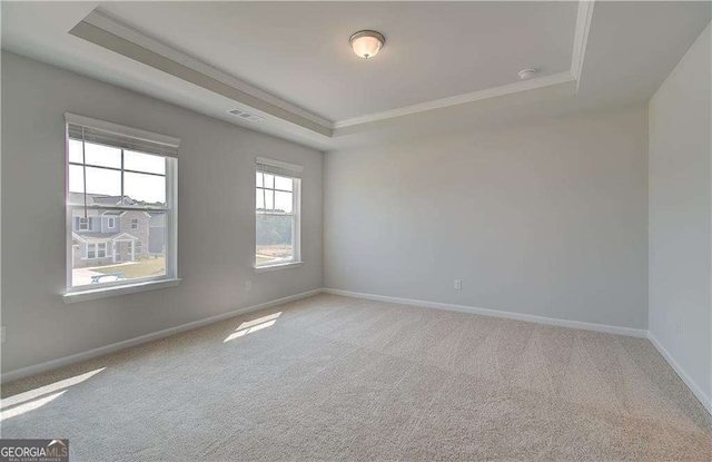 612 Sidney Ct, Stockbridge, GA 30281 - unfurnished room with a raised ceiling, crown molding, carpet flooring, and baseboards