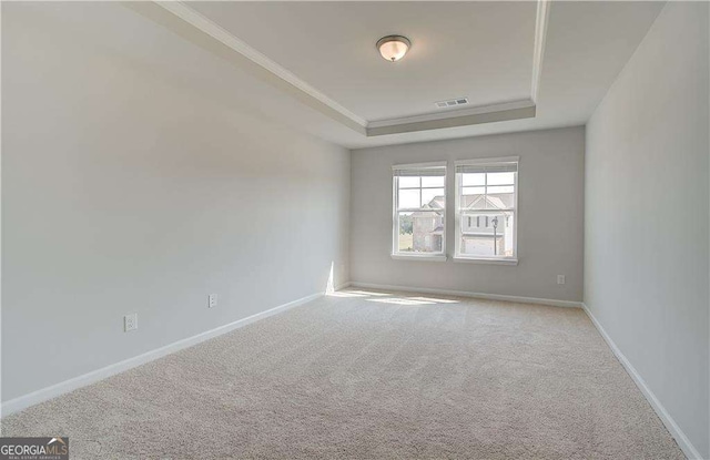 612 Sidney Ct, Stockbridge, GA 30281 - unfurnished room with a raised ceiling, carpet floors, crown molding, and baseboards