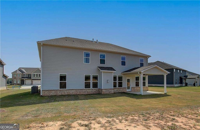 612 Sidney Ct, Stockbridge, GA 30281 - back of property featuring a patio, central air condition unit, and a lawn