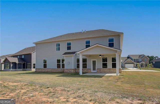 612 Sidney Ct, Stockbridge, GA 30281 - rear view of property featuring ceiling fan and a lawn