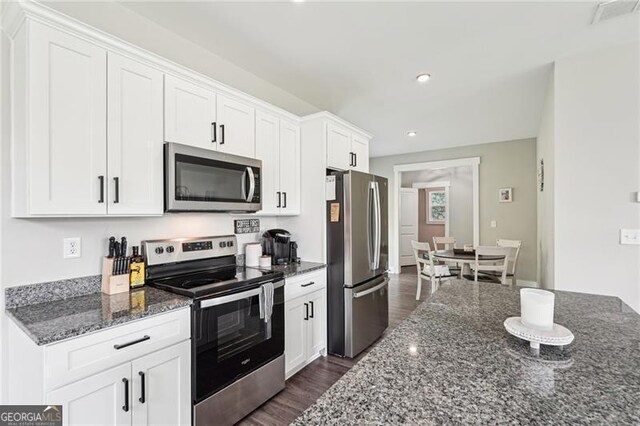 166 Wagon Trail Cir, Fairmount, GA 30139 - kitchen featuring stainless steel appliances, dark wood-type flooring, white cabinetry, dark stone countertops, and recessed lighting