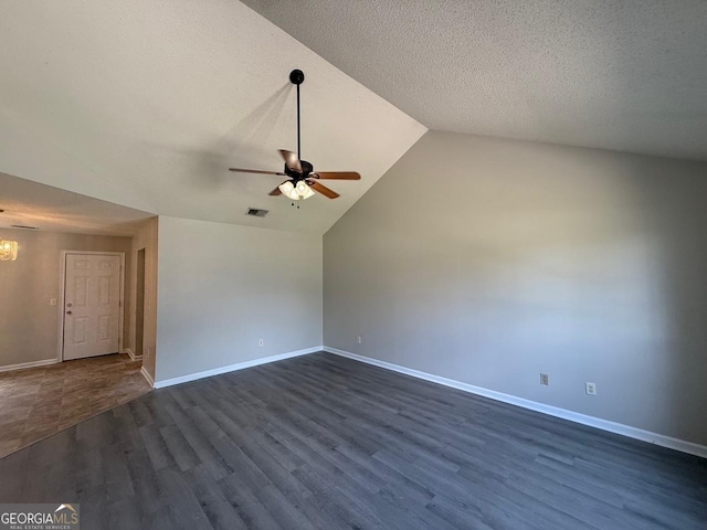 1397 Coalition Cir, Hinesville, GA 31313 - unfurnished room with a ceiling fan, dark wood-style flooring, lofted ceiling, baseboards, and a textured ceiling