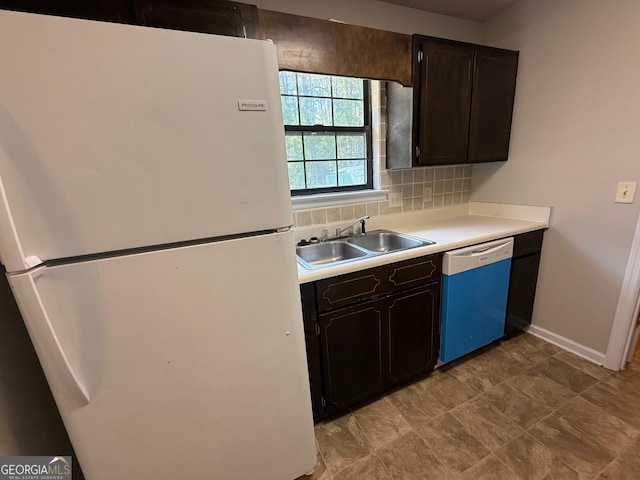 1397 Coalition Cir, Hinesville, GA 31313 - kitchen featuring freestanding refrigerator, dishwasher, a sink, light countertops, and backsplash