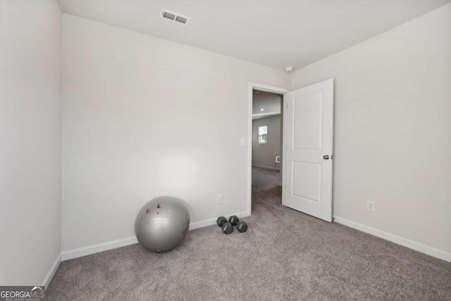 130 Maple Dr, Milner, GA 30257 - exercise area with carpet flooring and baseboards