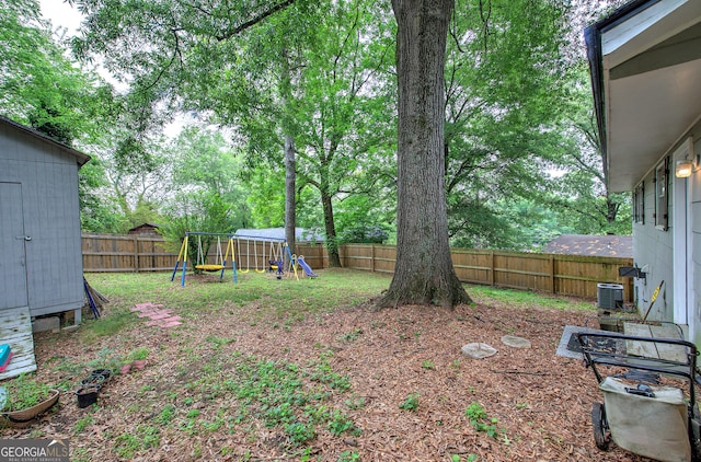 7 Valley View Dr, Cartersville, GA 30120 - fenced backyard with a playground and an outdoor structure