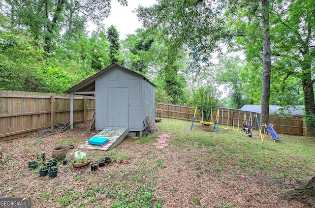 7 Valley View Dr, Cartersville, GA 30120 - fenced backyard with a playground and a shed
