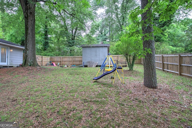 7 Valley View Dr, Cartersville, GA 30120 - fenced backyard with a playground and an outdoor structure