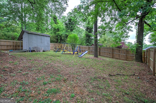 7 Valley View Dr, Cartersville, GA 30120 - fenced backyard featuring a playground and a storage unit