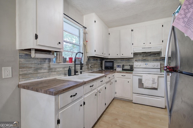 7 Valley View Dr, Cartersville, GA 30120 - kitchen featuring white electric range, freestanding refrigerator, under cabinet range hood, decorative backsplash, and a textured ceiling