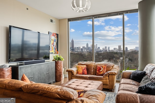 270 17th St NW Unit 1113, Atlanta, GA 30363 - living room featuring a wall of windows and wood finished floors