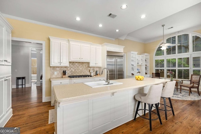 626 Kimberly Ln NE, Atlanta, GA 30306 - kitchen featuring stainless steel built in refrigerator, gas stovetop, a sink, ornamental molding, and light countertops