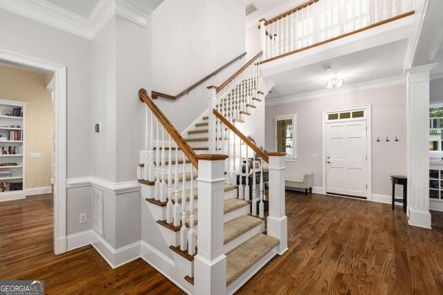 626 Kimberly Ln NE, Atlanta, GA 30306 - foyer entrance featuring plenty of natural light, wood finished floors, crown molding, stairway, and baseboards