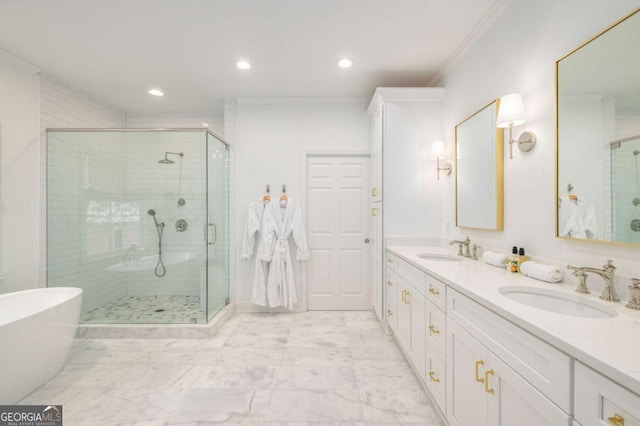 626 Kimberly Ln NE, Atlanta, GA 30306 - bathroom with a stall shower, recessed lighting, double vanity, crown molding, and marble finish flooring
