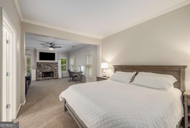 626 Kimberly Ln NE, Atlanta, GA 30306 - bedroom featuring light carpet, crown molding, a fireplace, baseboards, and a ceiling fan