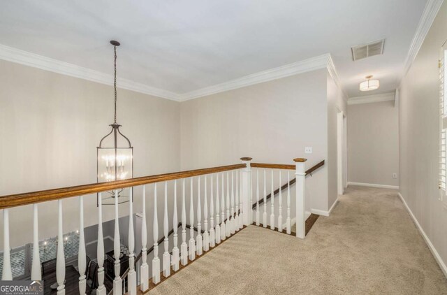 626 Kimberly Ln NE, Atlanta, GA 30306 - hallway featuring a chandelier, carpet, an upstairs landing, crown molding, and baseboards