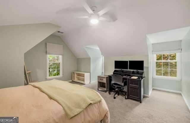 626 Kimberly Ln NE, Atlanta, GA 30306 - bedroom with light carpet, multiple windows, vaulted ceiling, a ceiling fan, and baseboards